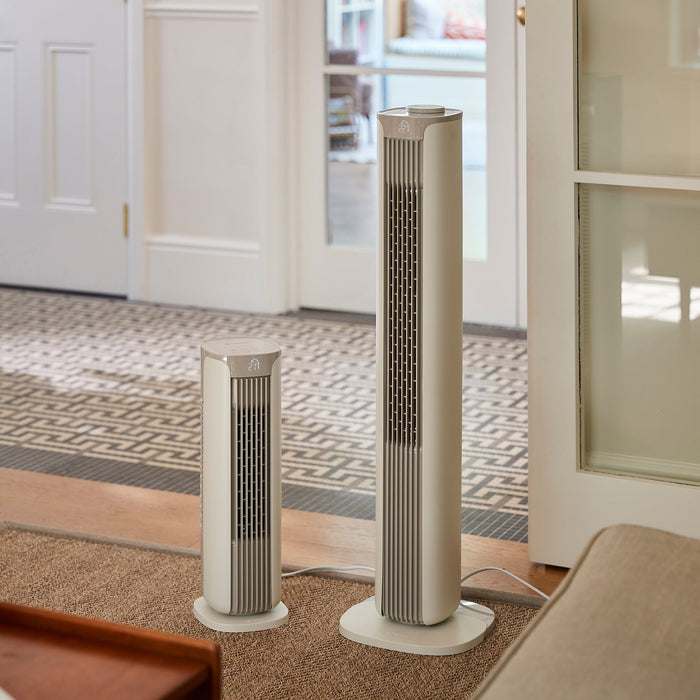 MeacoFan Sefte 19" Tower Fan beside the taller Sefte Smart 36" Tower Fan in a hallway, showing the size difference